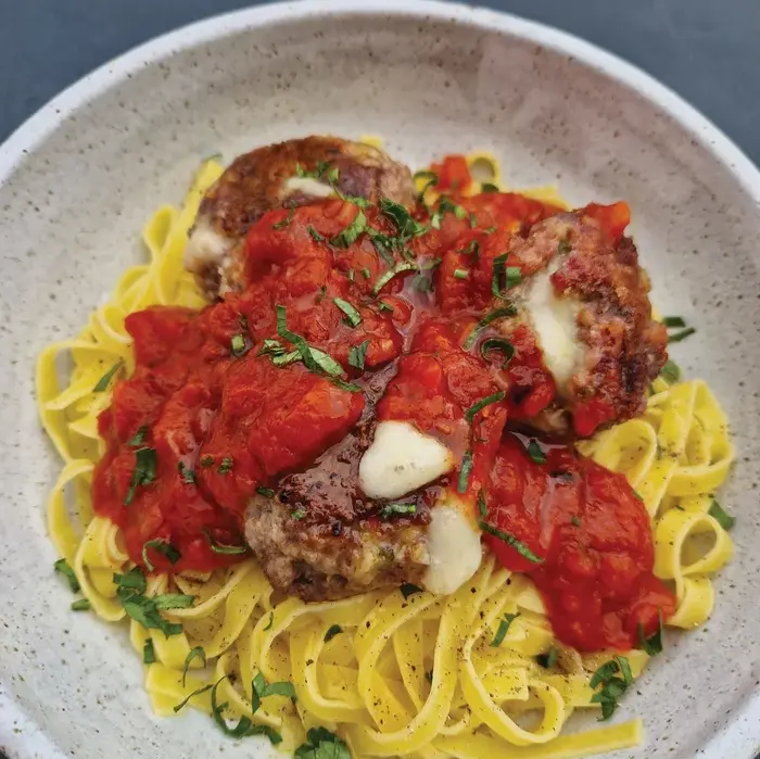 These tasty cheesy meatballs are delicious with the simple vibrant tomato sauce on pasta or, alternatively, make a first-class meatball sandwich.