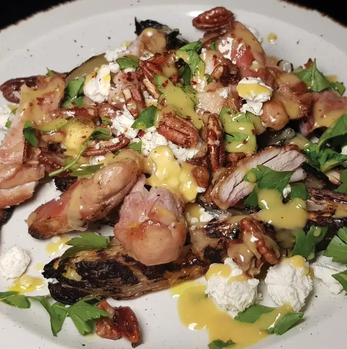 The bitter chicory, salty feta, and sweet, hot and spicy pecans provide a great mix of taste and texture and elevate good old chicken thighs to something special.