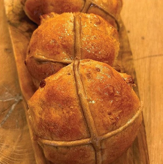 Try making traditional Hot Cross Buns on the BBQ! Soft, spiced dough studded with sultanas, topped with a cross, and glazed with apricot jam.