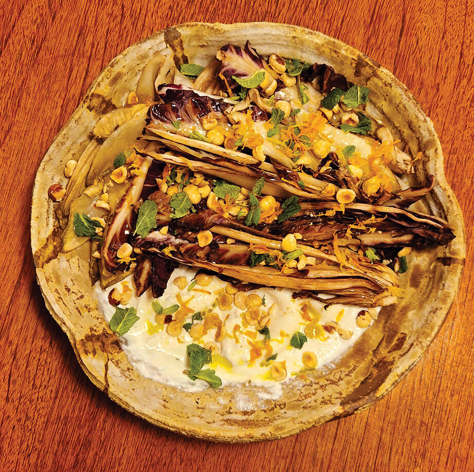 Burrata is a pimped-up mozzarella with extra cream. This dish works with any bitter leaves if they are charred, as long as they can hold their shape for the oozy burrata, orange and nut mixture.