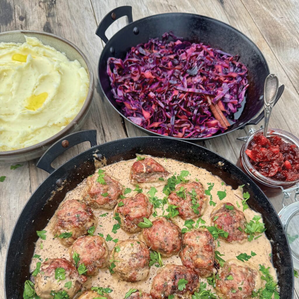 Juicy pork and beef meatballs are gently cooked and finished in a rich, creamy gravy infused with warming spices and a hint of smoke. Paired with fragrant spiced red cabbage and a sweet-tart cranberry and apple sauce, this dish delivers a comforting balance of savoury depth and festive brightness.