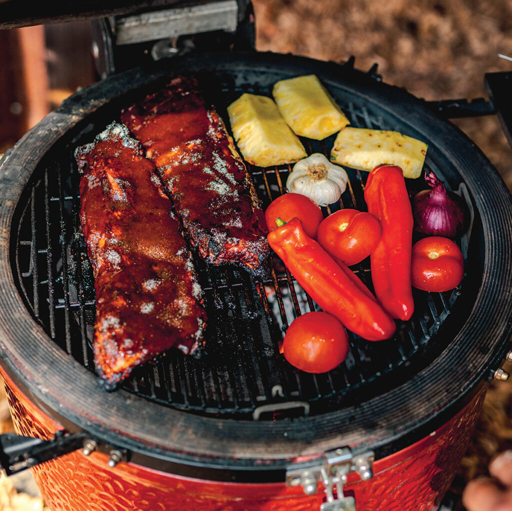 Baby back ribs rubbed with jerk seasoning, smoked over wood chunks until fall-off-the-bone tender, then glazed with jerk sauce for a finish that's sticky, spiced and impossible to resist.