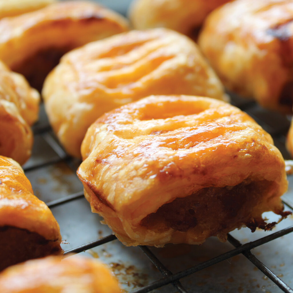 Phil Roberts takes the humble sausage roll somewhere it's never been before — smoky pulled pork and crumbled Stilton folded into seasoned sausage meat, wrapped in all-butter puff pastry and baked low and slow on the pellet grill with a kiss of apple or oak smoke.